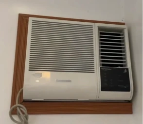 Window AC unit installed through exterior wall